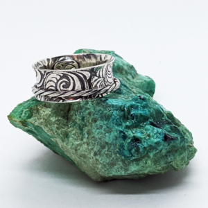Tooled leather pattern flared ring with spinning twisted sterling band